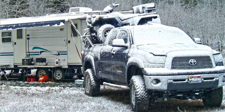 Toyota Tundra carrying an ATV