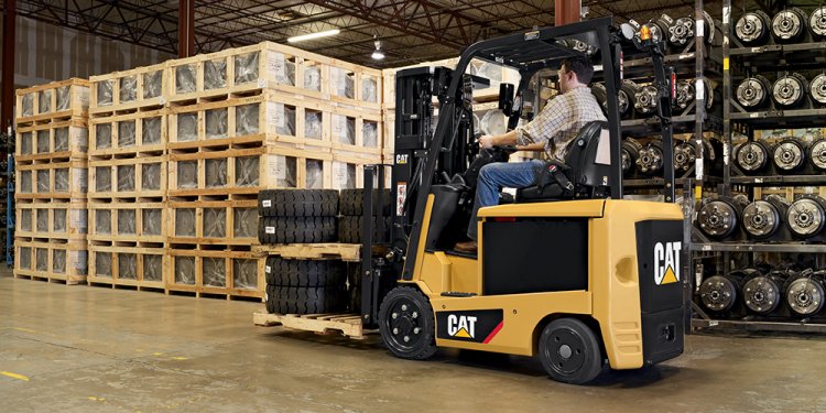 Cat forklift carrying cargo