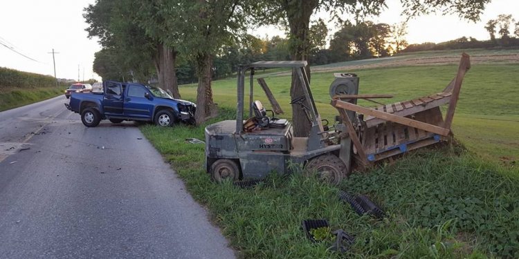 Pickup truck strikes forklift