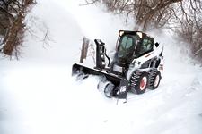 Bobcat S590 M2-Series skid-steer loader with snowblower attachment.