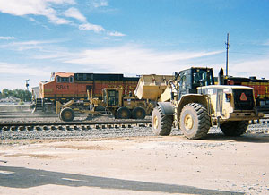 Caterpillar® wheel loader / rubber tire loader at a rail yard.