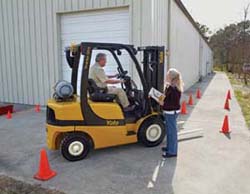 Operator being trained on working on a loading dock. Operator being trained on working on a loading dock.