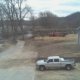 Concrete trucks pouring