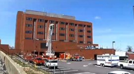 The crane was used to lift Butler from a deck on the four-story nursing home in Providence.
