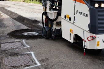 The manhole cover is milled around neatly and quickly in a single pass.